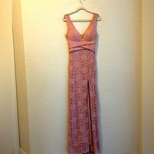 Ankle length dress with a slit to the knee, with a plunge at the neckline.
